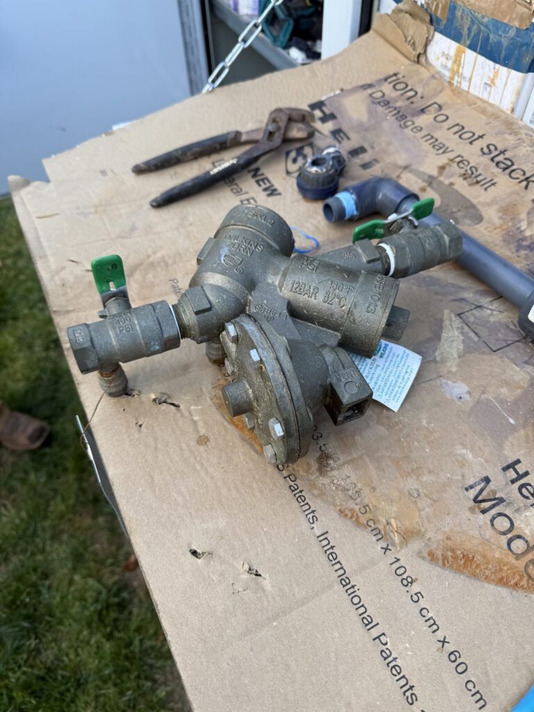 New backflow assembly and fittings staged for a replacement job in the Triangle, NC