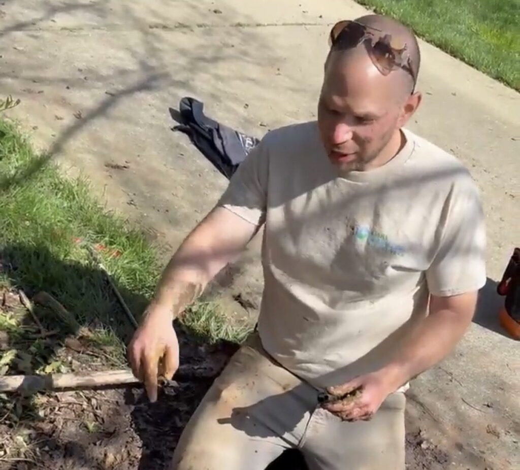 Cary Sprinklers & French Drains technician on a residential irrigation job in Cary, NC