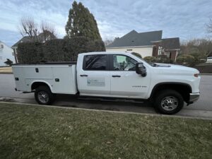 Cary Sprinklers & French Drains service truck parked in a Triangle, NC neighborhood