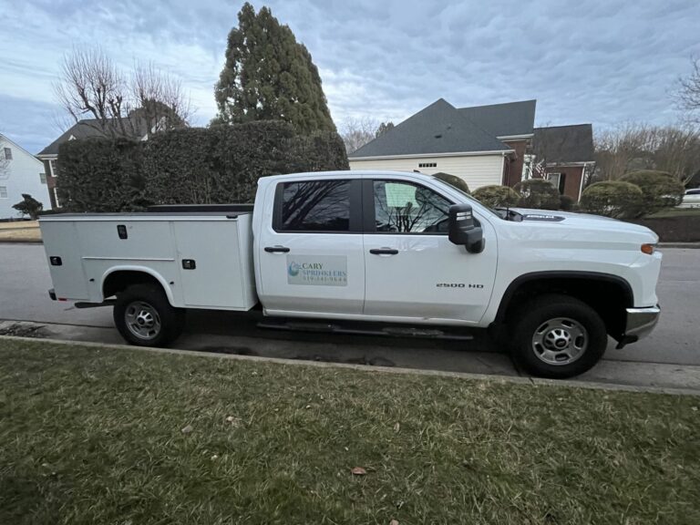 Cary Sprinklers & French Drains service truck parked in a Triangle, NC neighborhood