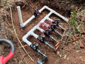 Irrigation valve manifold rebuilt with new PVC and wiring during a repair in Cary, NC