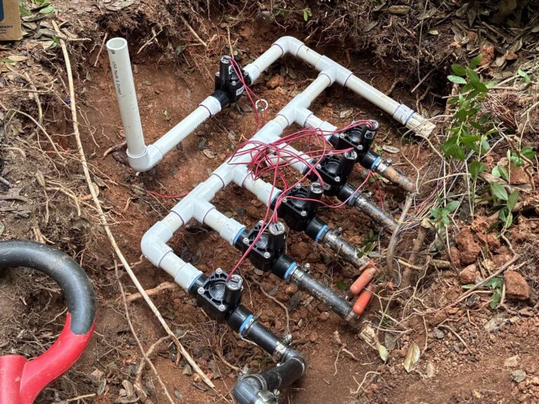 Irrigation valve manifold rebuilt with new PVC and wiring during a repair in Cary, NC